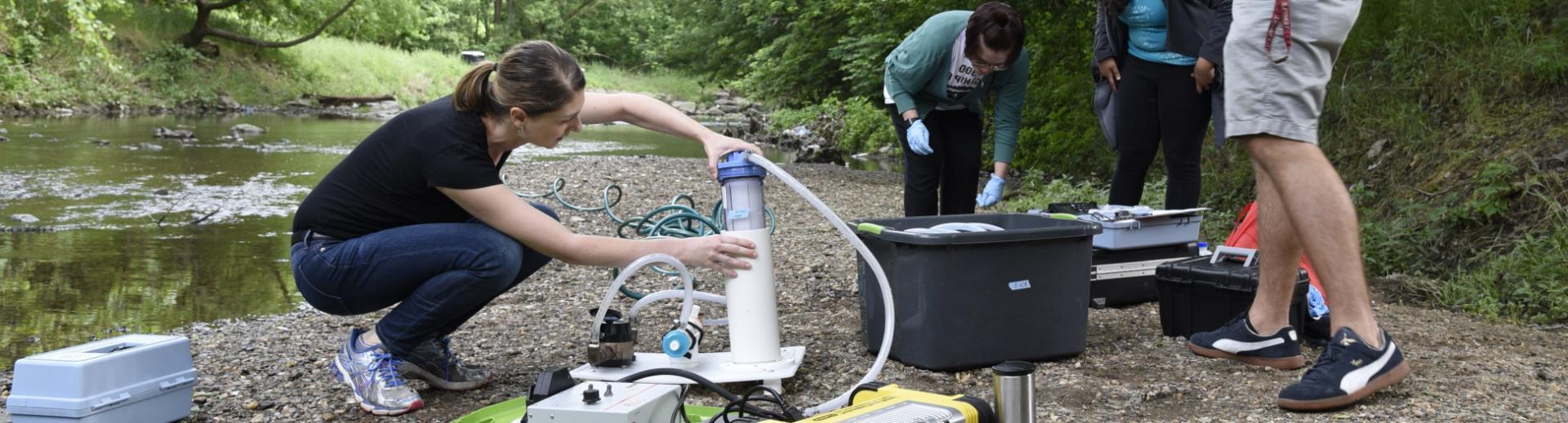 Environmental health class testing river water